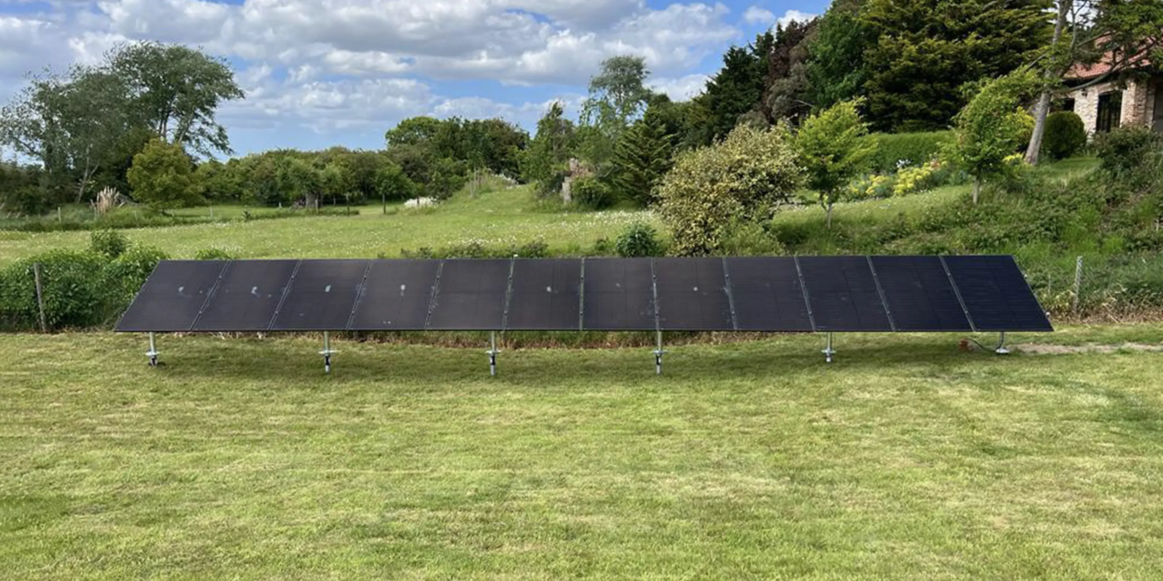 12-panel domestic solar array mounted on six ground screw foundations